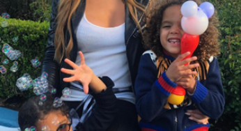 Mariah Carey visits Disneyland with her kids.